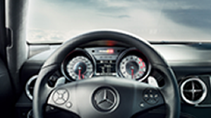 Mercedes-Benz Steering Wheel Black steering wheel and interior dashboard of a Mercedes-Benz C-Class.
